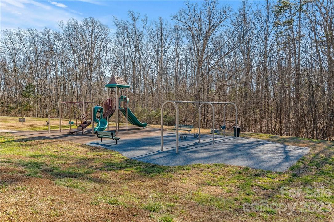 4108 Cedar Point Avenue Matthews, NC 28104 - Photo 39 of 41 a view of a park with swings and slides