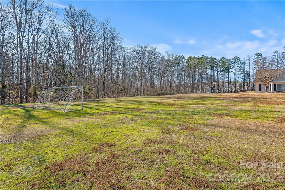 4108 Cedar Point Avenue Matthews, NC 28104 - Photo 41 of 41 a view of a swimming pool with an outdoor seating