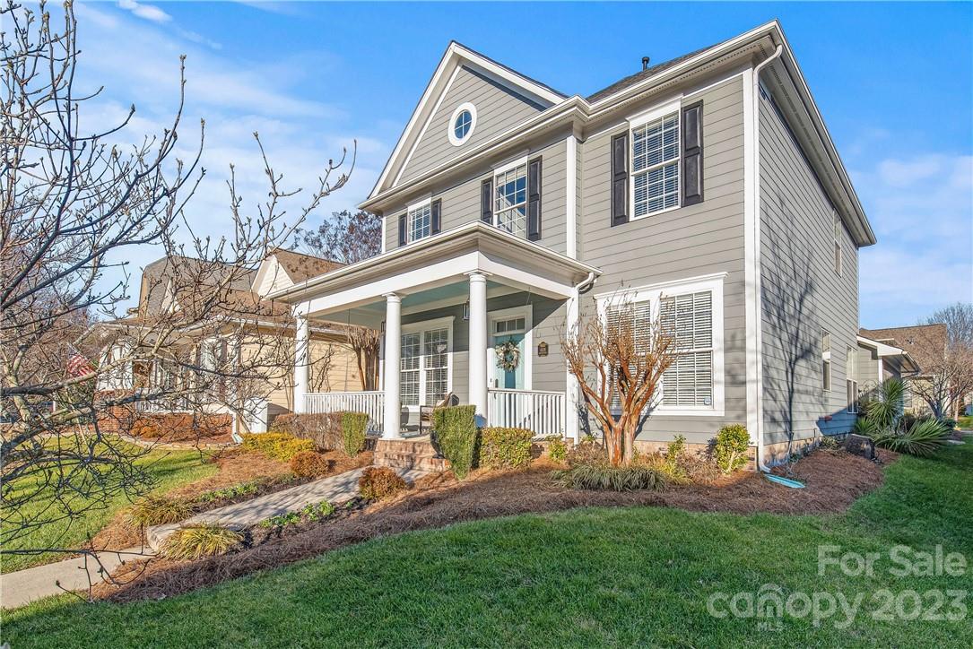 4108 Cedar Point Avenue Matthews, NC 28104 - Photo 5 of 41 a front view of a house with a yard and porch