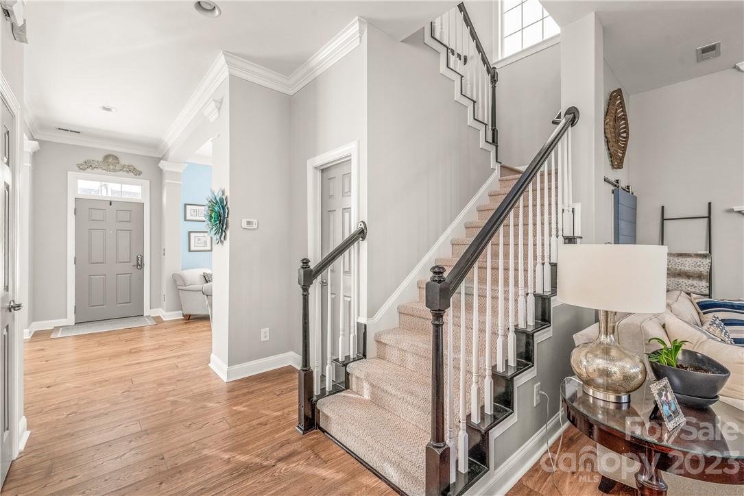 4108 Cedar Point Avenue Matthews, NC 28104 - Photo 8 of 41 a view of entryway and hall with wooden floor