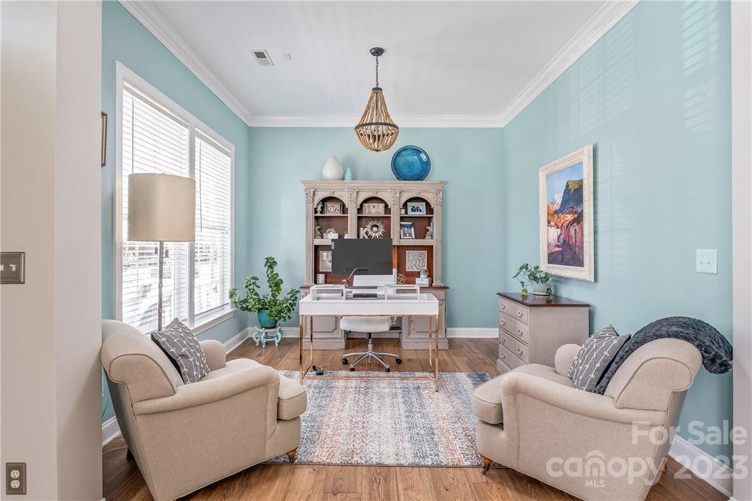 4108 Cedar Point Avenue Matthews, NC 28104 - Photo 9 of 41 a living room with furniture two window and wooden floor