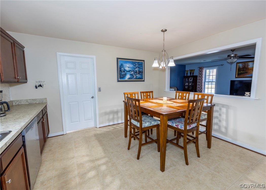 289 Winding Ridge Way Bumpass, VA 23024 - Photo 8 of 46 a dining room with a granite table and chairs