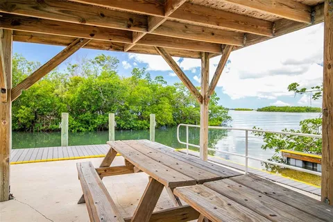 a view of a patio with wooden floor