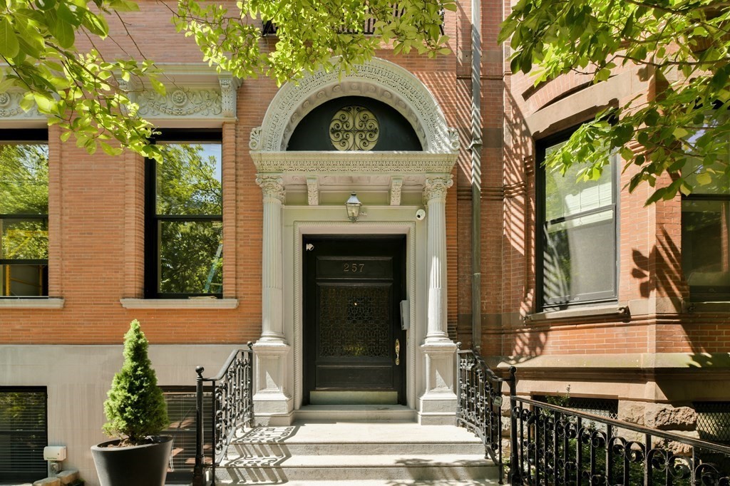 257 Commonwealth Avenue, Unit 2 Boston, MA 02116 - Photo 1 of 10 a front view of a house with a garden