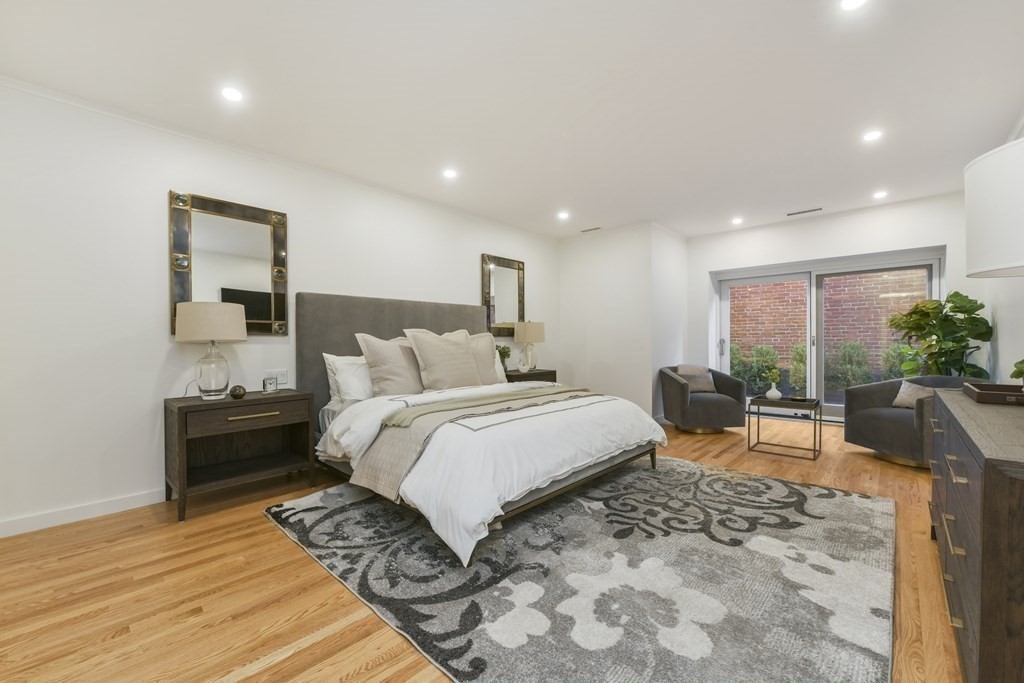 257 Commonwealth Avenue, Unit 2 Boston, MA 02116 - Photo 6 of 10 a bed room with a bed and a couch