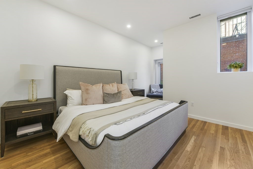 257 Commonwealth Avenue, Unit 2 Boston, MA 02116 - Photo 8 of 10 a bedroom with a bed and a window
