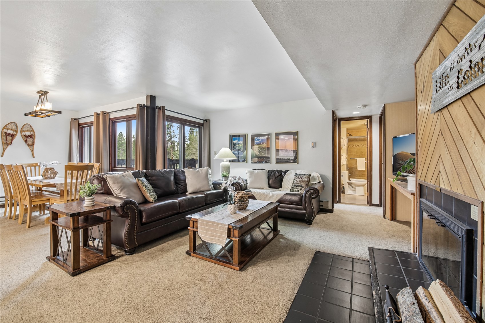 423 Wild Irishman Road, Unit 1008 1009 Keystone, CO 80435 - Photo 3 of 28 a living room with furniture fireplace and a flat screen tv