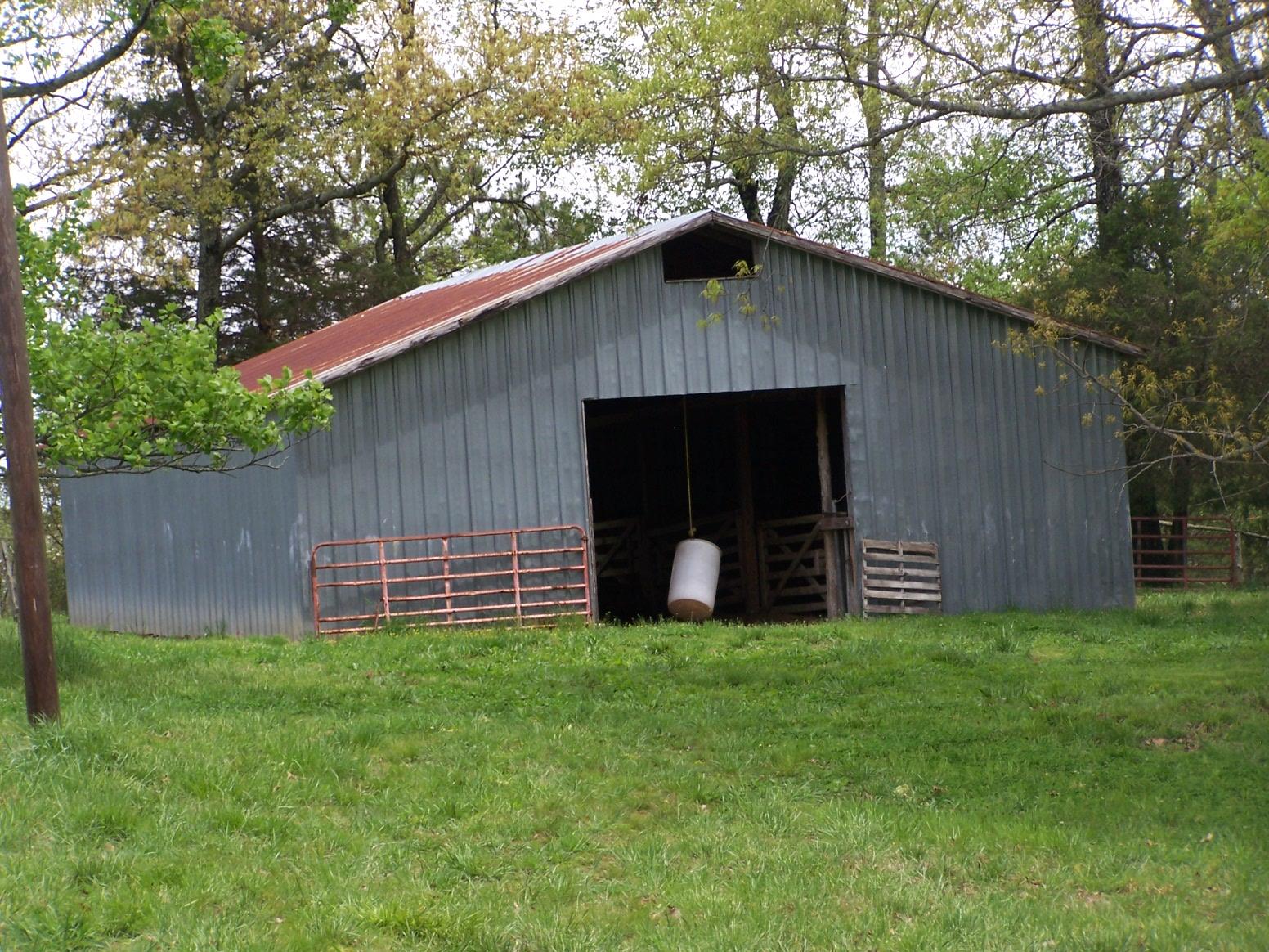 0 Jackson Hollow Road Goodspring, TN 38460 - Photo 22 of 29 a backyard of a house with table and chairs