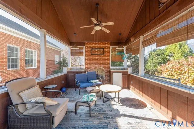 a balcony with furniture and a large window