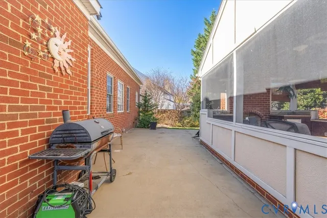 a view of balcony with two chairs and a potted plant