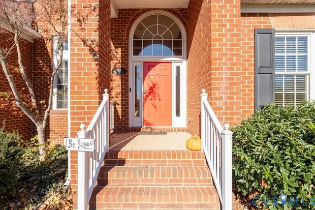 a view of a brick house with many windows