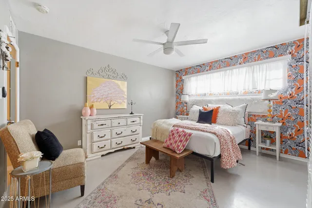 a view of a hallway with bathroom and glass door