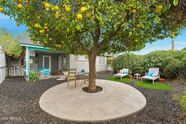 a front view of a house with outdoor seating
