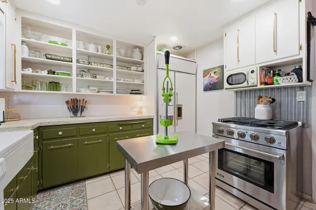 a room with a chair and appliances