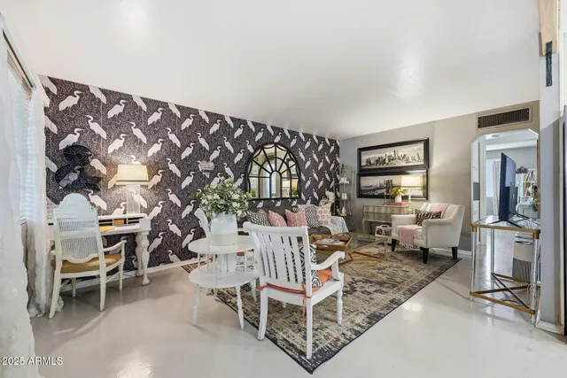 a view of backyard with outdoor seating and green space