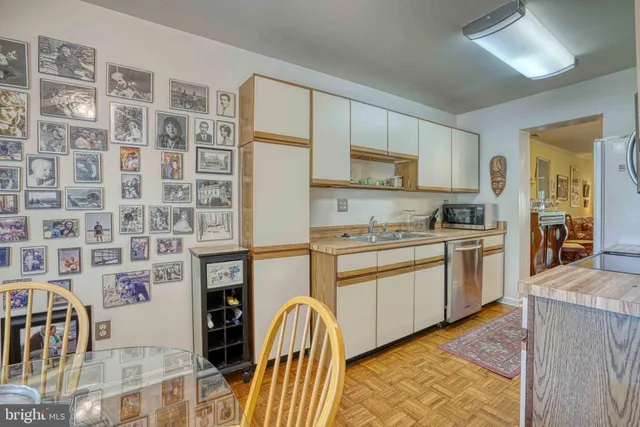 a kitchen with a cabinets and wooden floor