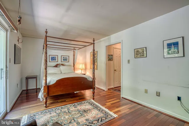 a bedroom with a bed and a walk in closet