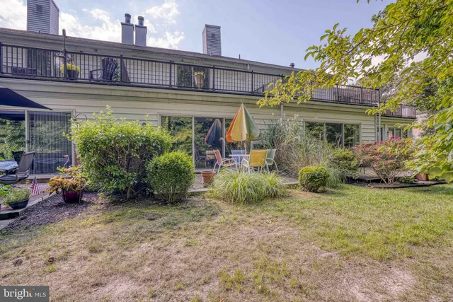 a view of a dining room with a table and chairs