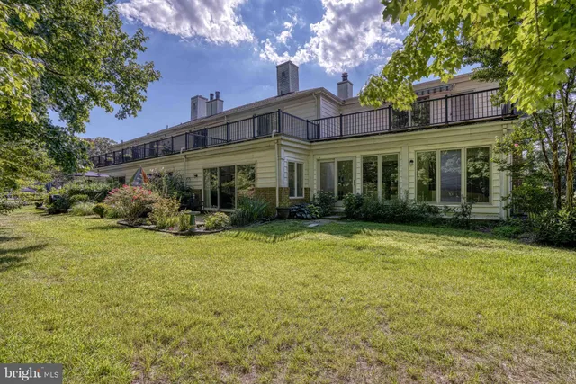 a view of a yard with swimming pool