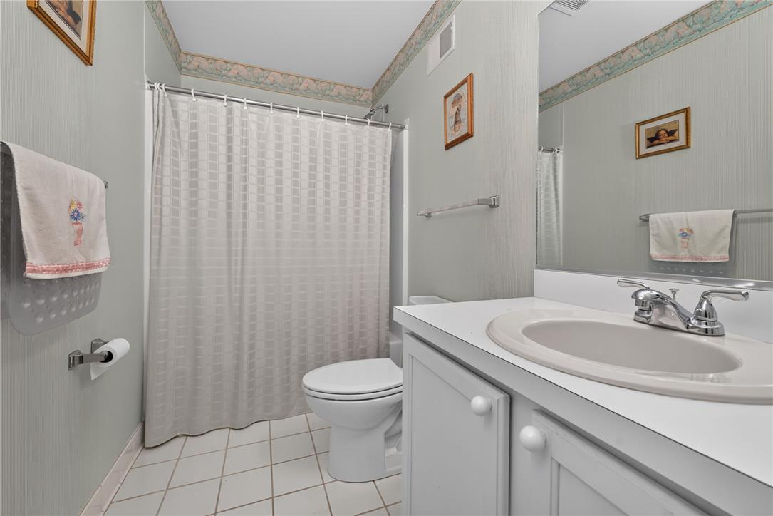 198 Park Ridge Drive Easton, PA 18040 - Photo 16 of 28 A well-appointed bathroom features a single vanity, a standard toilet, and a combined shower-bathtub.