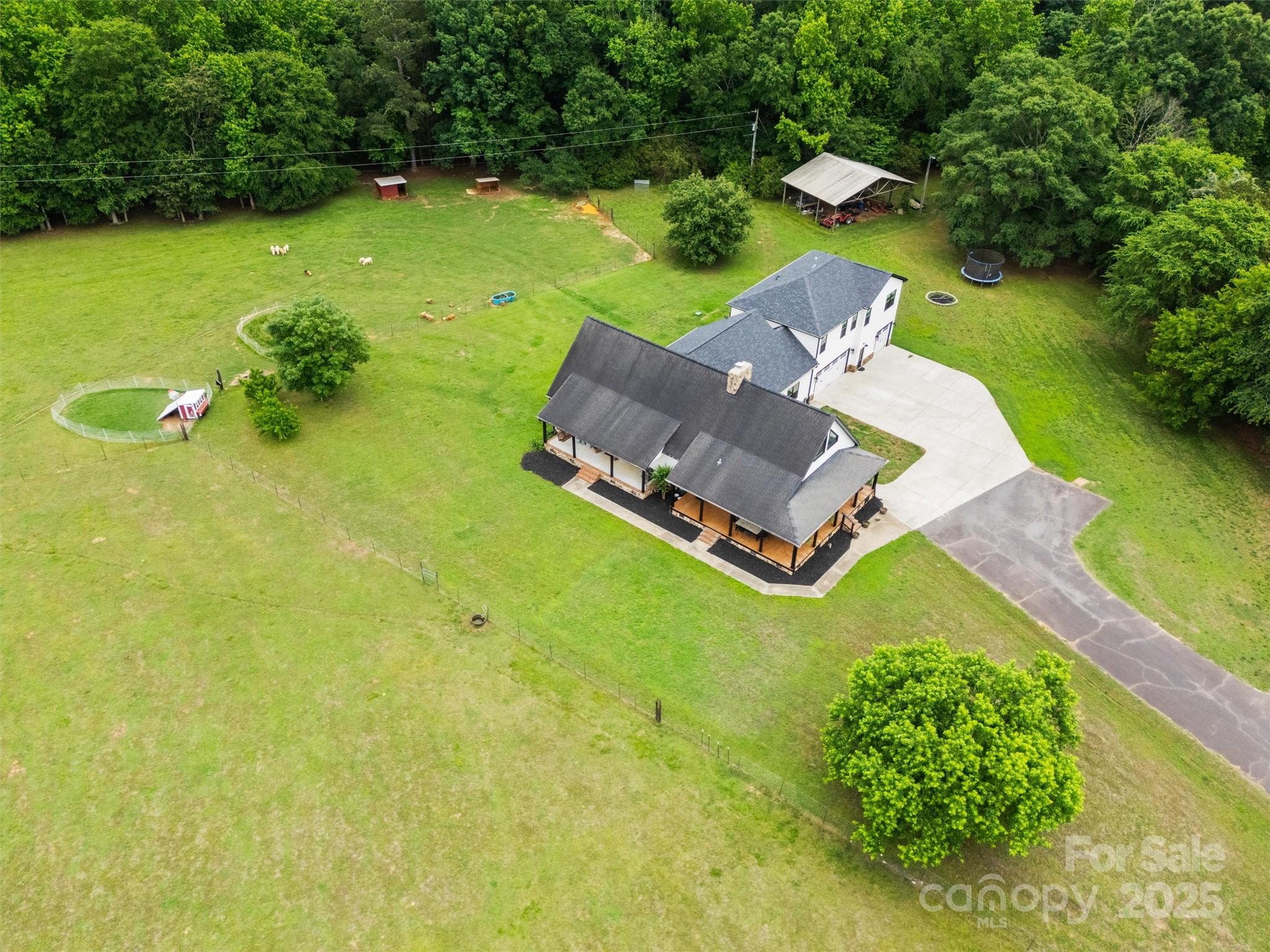 930 Hawley Road McConnells, SC 29726 - Photo 46 of 47 an aerial view of a house with swimming pool and garden