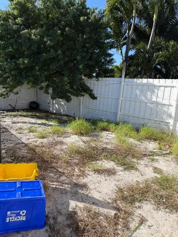 a view of a backyard of the house