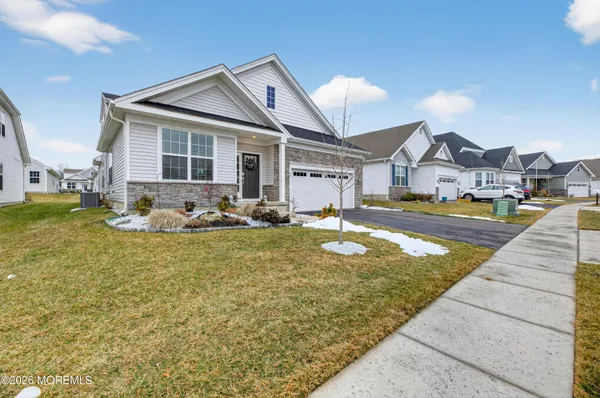 a livingroom with workspace and a couch