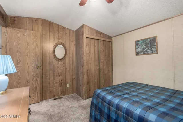 a bedroom with a bed and a cabinets