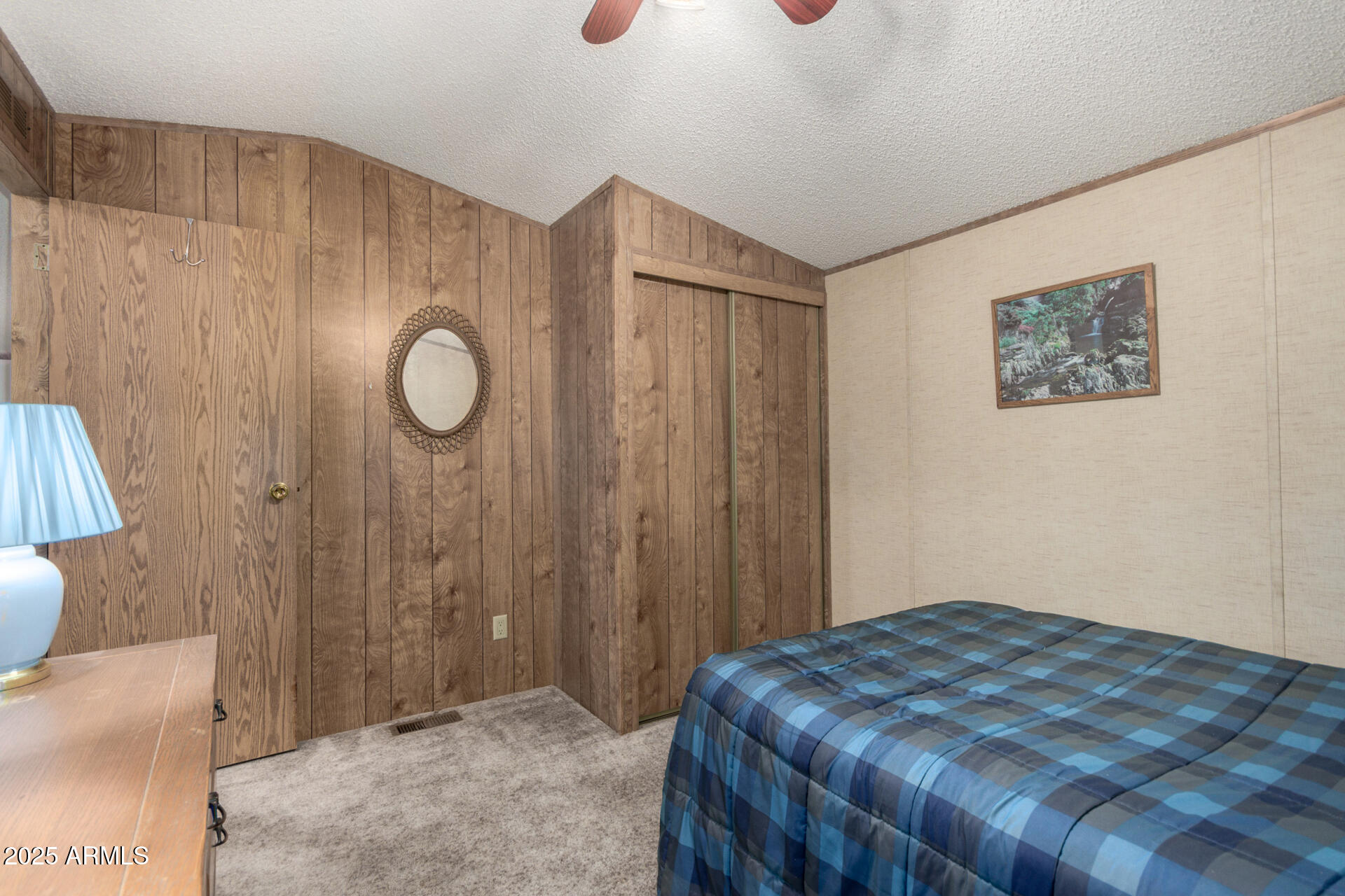 11101 East University Drive, Unit 214 Apache Junction, AZ 85120 - Photo 15 of 30 a bedroom with a bed and a cabinets
