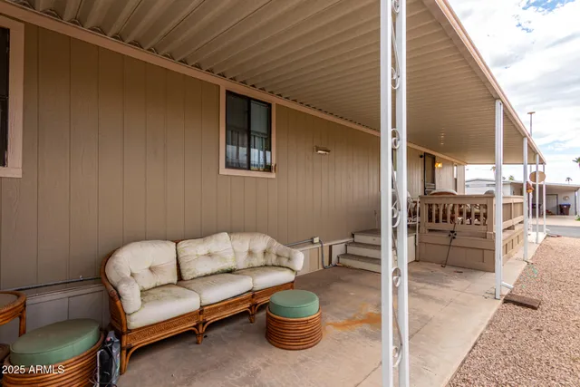 a view of a patio with a dining table and chairs