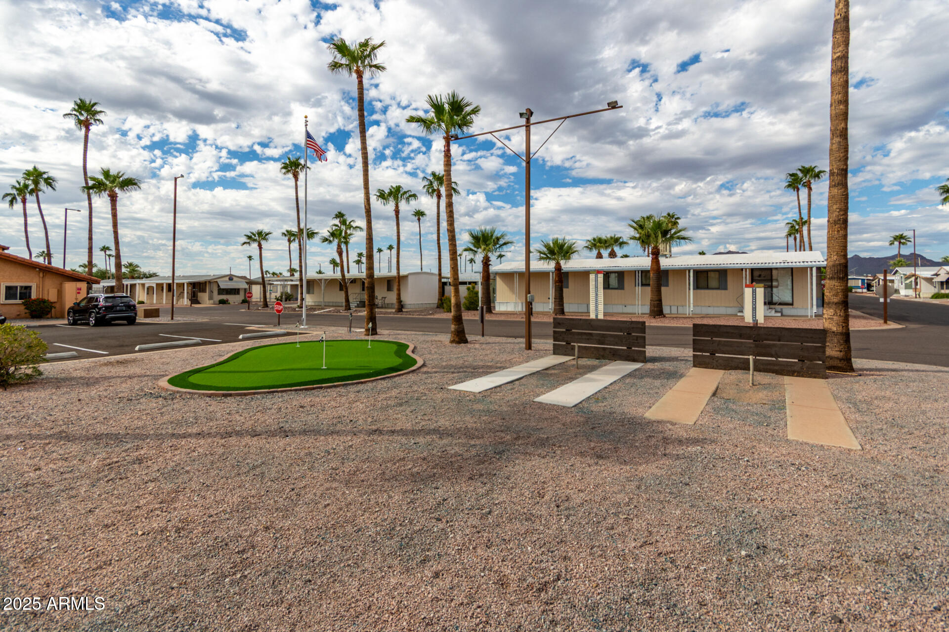 11101 East University Drive, Unit 214 Apache Junction, AZ 85120 - Photo 20 of 30 a view of a park with swings