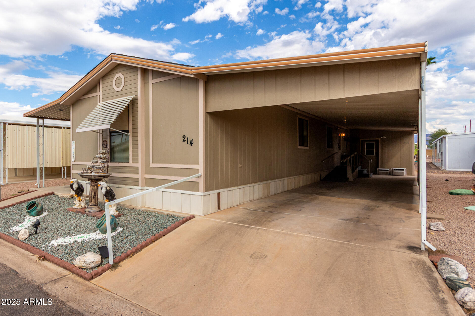11101 East University Drive, Unit 214 Apache Junction, AZ 85120 - Photo 2 of 30 a view of a house with a patio
