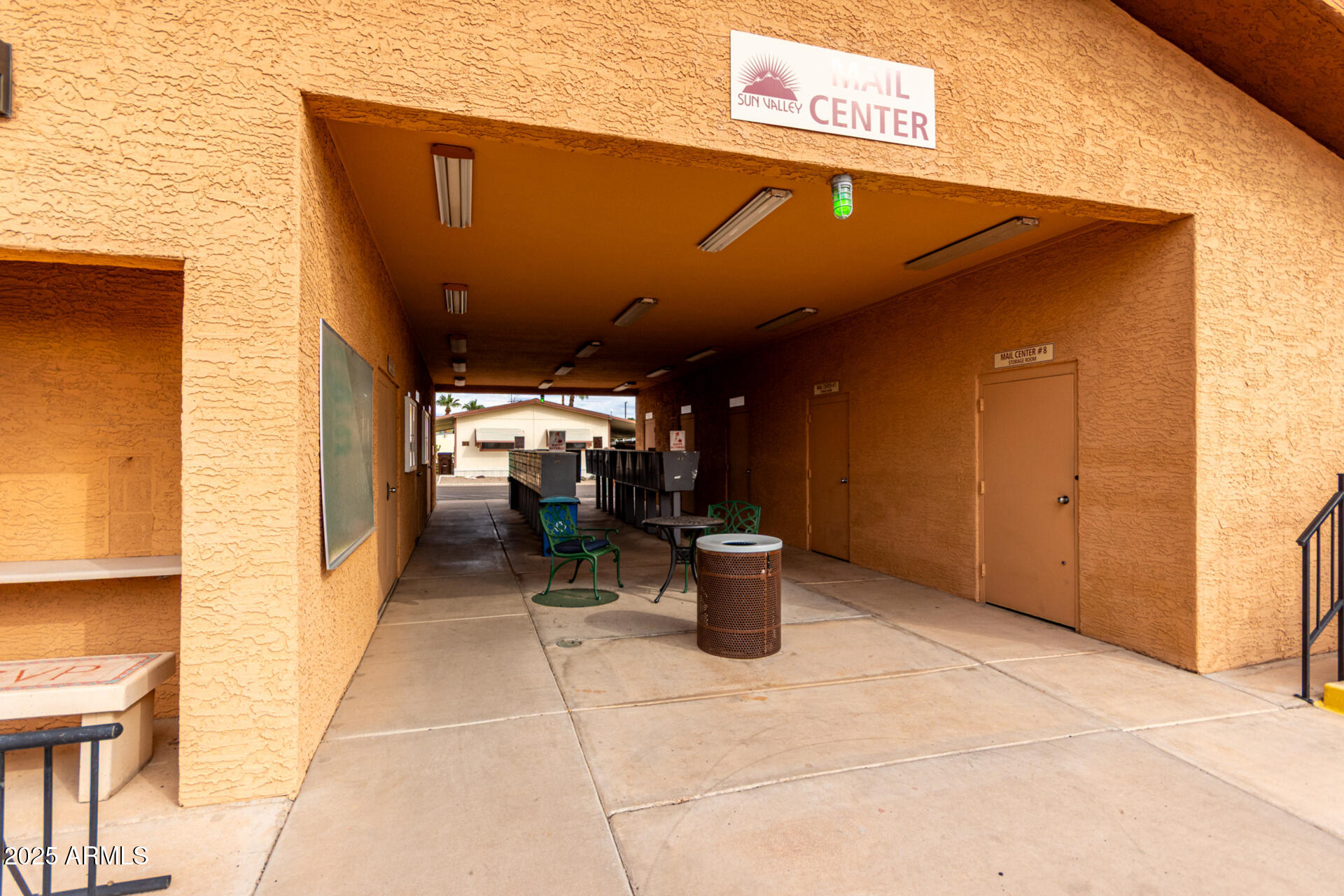 11101 East University Drive, Unit 214 Apache Junction, AZ 85120 - Photo 22 of 30 a view of a patio with table and chairs
