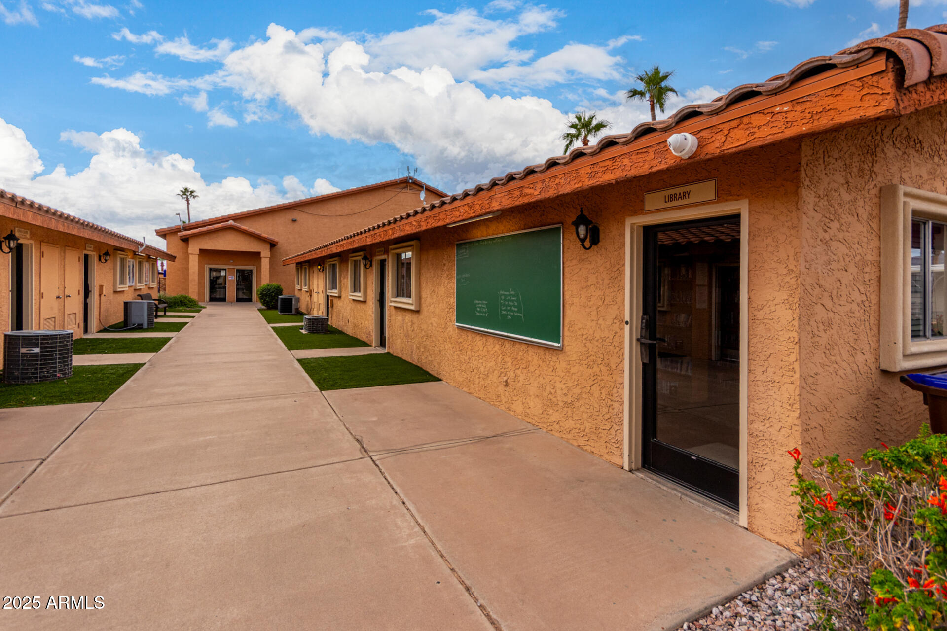 11101 East University Drive, Unit 214 Apache Junction, AZ 85120 - Photo 25 of 30 a front view of house with yard
