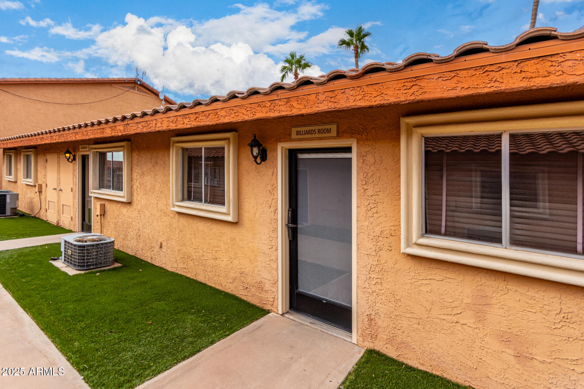 11101 East University Drive, Unit 214 Apache Junction, AZ 85120 - Photo 26 of 30 a front view of a house with a yard