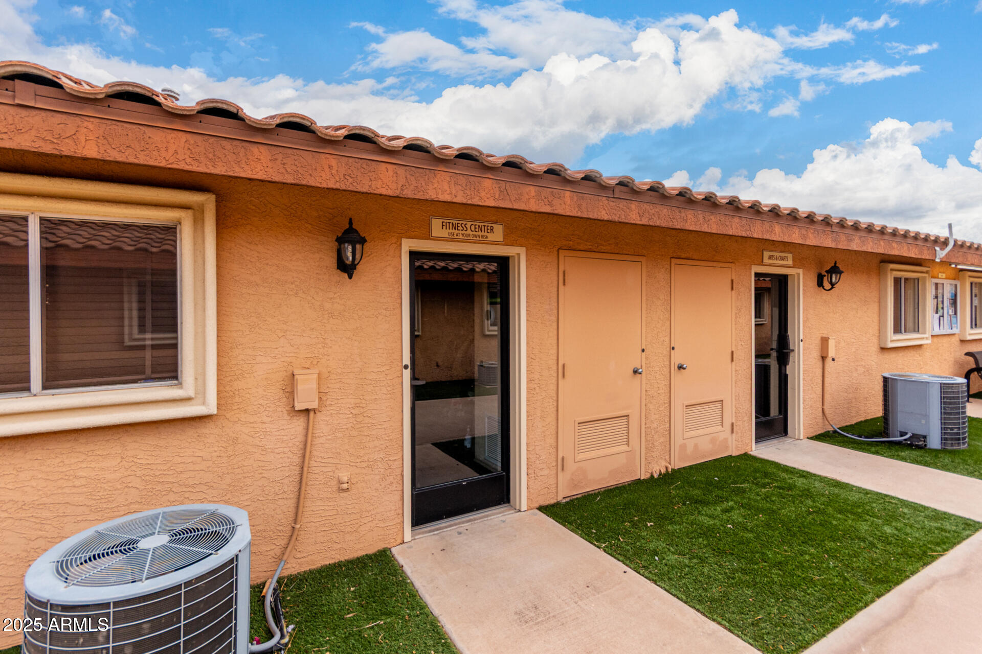 11101 East University Drive, Unit 214 Apache Junction, AZ 85120 - Photo 27 of 30 front view of a house with a yard
