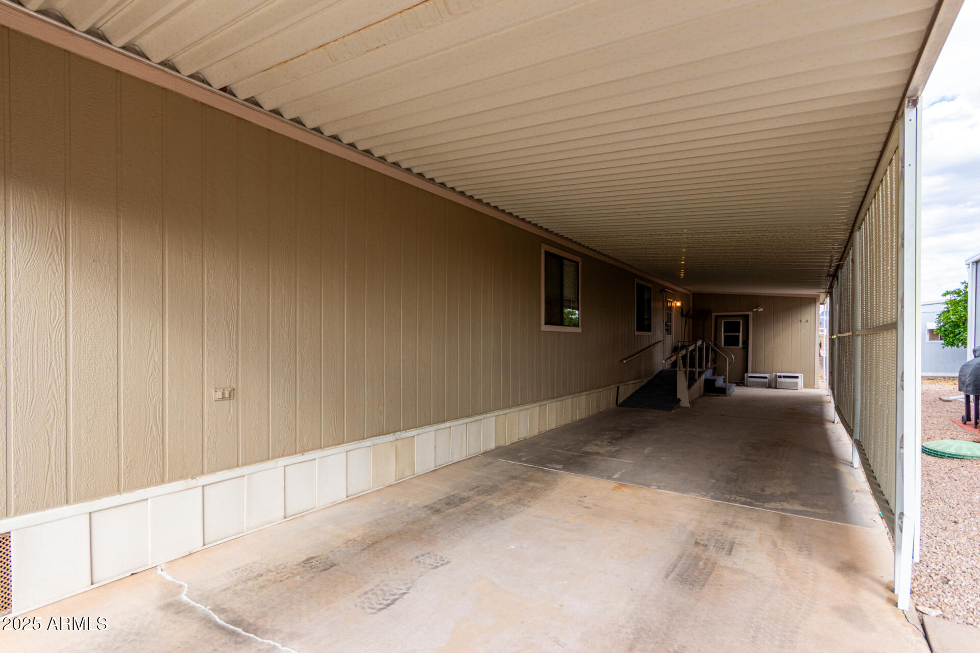 11101 East University Drive, Unit 214 Apache Junction, AZ 85120 - Photo 3 of 30 a view of a big room with wooden walls