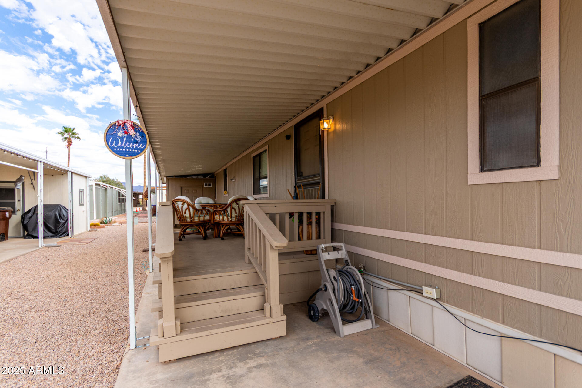 11101 East University Drive, Unit 214 Apache Junction, AZ 85120 - Photo 4 of 30 a view of a patio with table and chairs