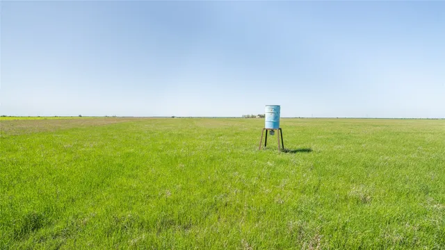 a view of a lake with a yard