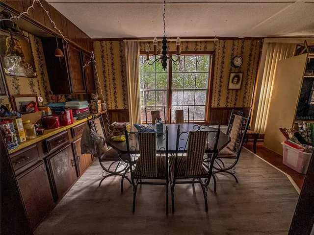 a view of a yard with trees in the background