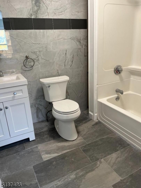 336 Bloomfield Avenue Caldwell, NJ 07006 - Photo 5 of 8 a bathroom with a toilet a sink and bathtub