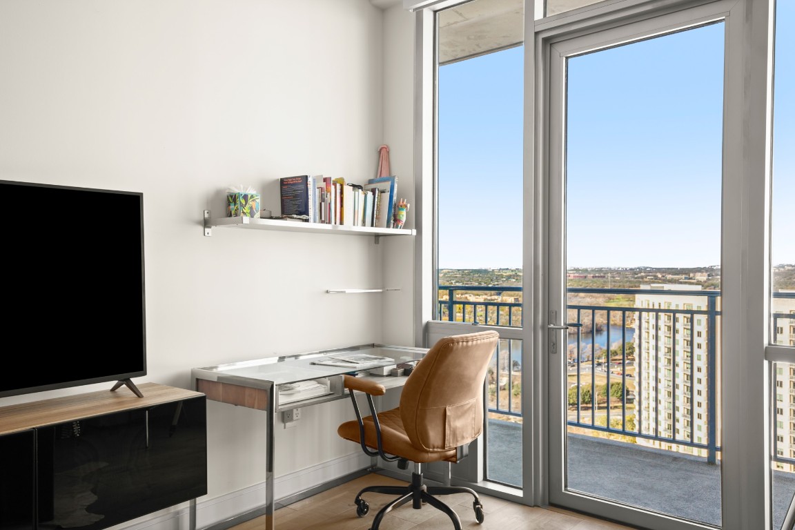 222 West Avenue, Unit 2012 Austin, TX 78701 - Photo 10 of 37 a view of a workspace with furniture and a window