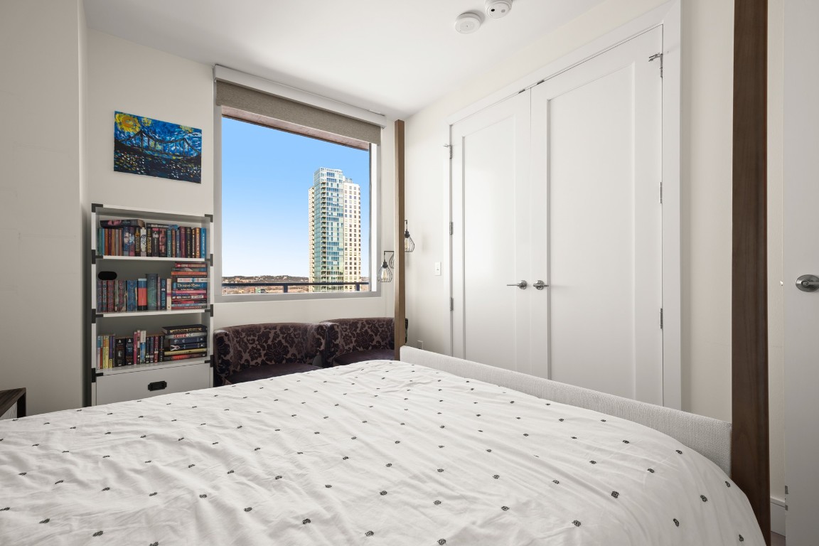 222 West Avenue, Unit 2012 Austin, TX 78701 - Photo 12 of 37 a bedroom with a bed and a window