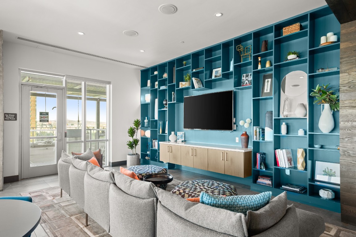 222 West Avenue, Unit 2012 Austin, TX 78701 - Photo 26 of 37 a living room with furniture and a flat screen tv