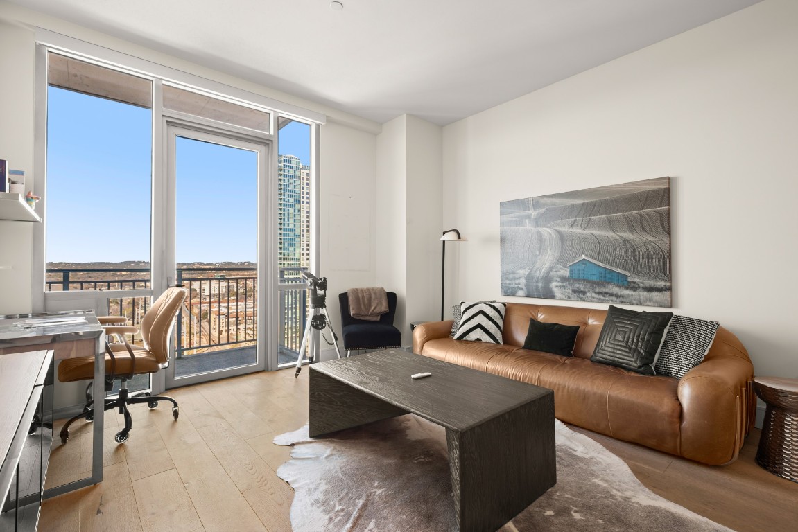 222 West Avenue, Unit 2012 Austin, TX 78701 - Photo 5 of 37 a living room with furniture and a window
