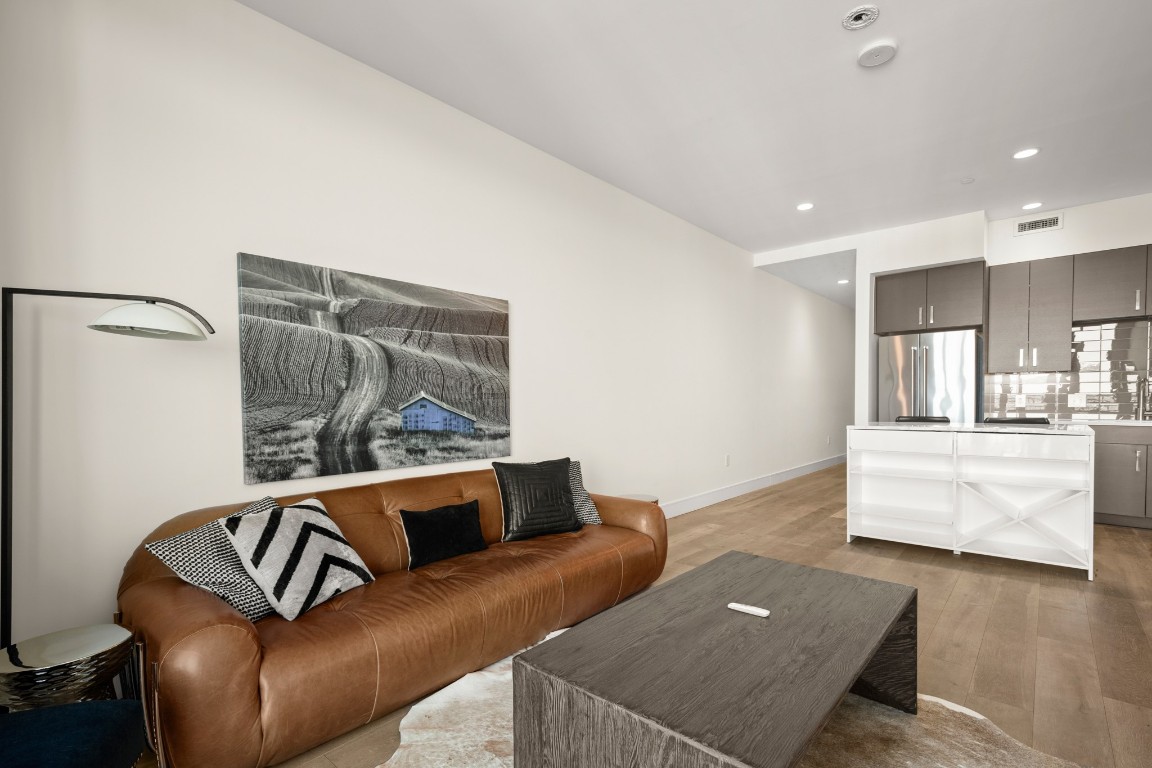 222 West Avenue, Unit 2012 Austin, TX 78701 - Photo 8 of 37 a living room with furniture and a flat screen tv