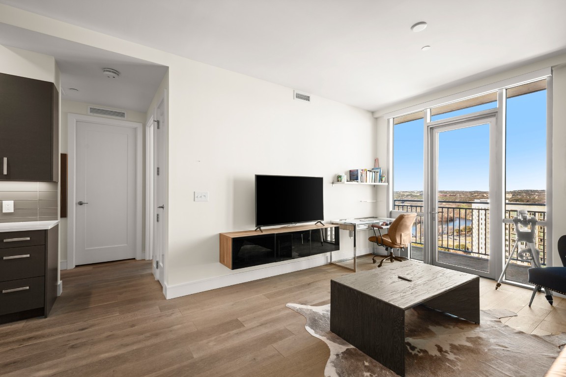 222 West Avenue, Unit 2012 Austin, TX 78701 - Photo 9 of 37 a living room with couch flat screen tv and view of living room