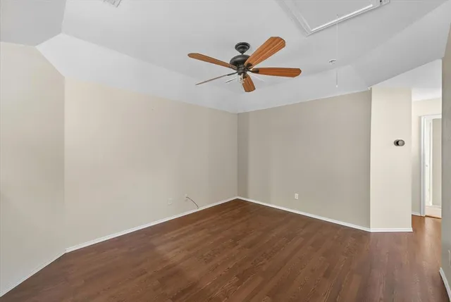 a view of a room with wooden floor