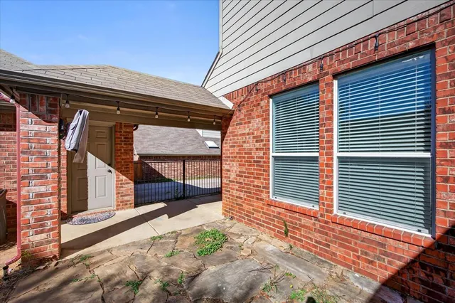 a view of a house with backyard and wooden floor
