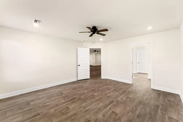 a white bath tub sitting next to a white sink